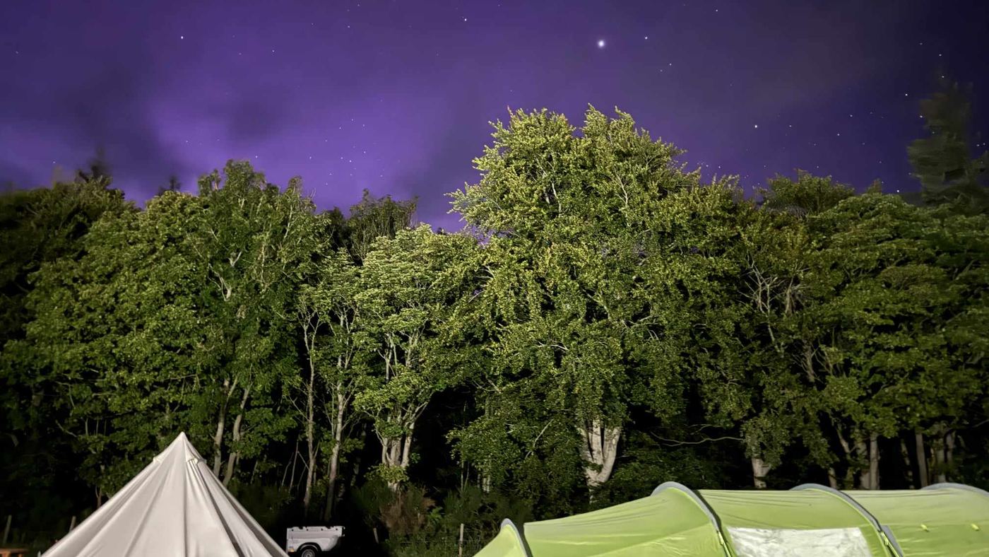 Tents on the camping field at Greencraig under a starry night sky