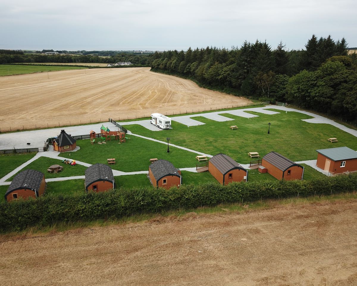 Greencraig from the air: the pods, the barbecue hut, the pitches and the fields around them